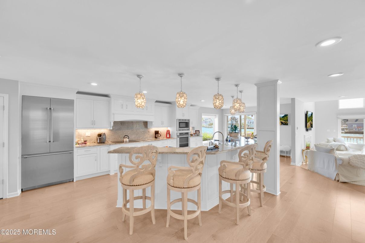 Chandelier, Interior, Kitchen, Pendant Lights, Recessed Lighting, Stainless Steel Appliances, Wood Texture Flooring