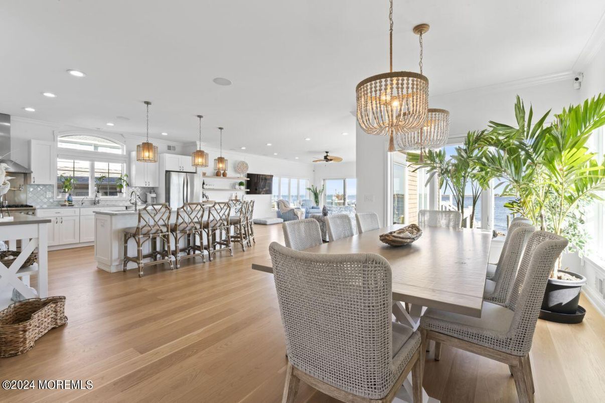 Chandelier, Dining room, Interior, Kitchen, Pendant Lights, Recessed Lighting, Stainless Steel Appliances, Wood Texture Flooring