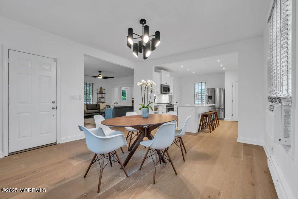 Chandelier, Dining room, Interior, Kitchen, Living room, Recessed Lighting, Stainless Steel Appliances, Wood Texture Flooring