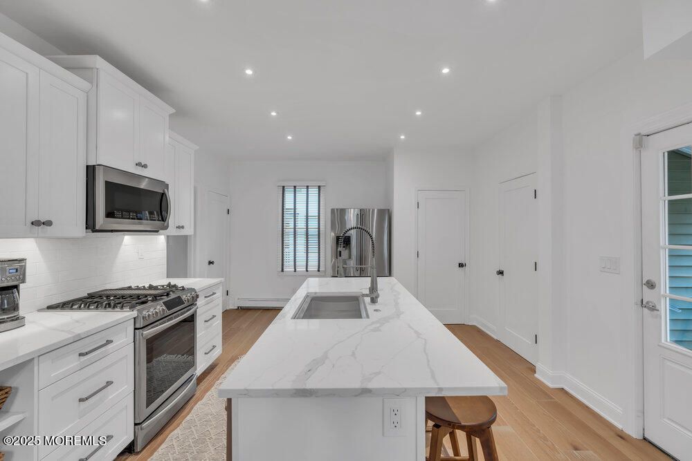 Interior, Kitchen, Recessed Lighting, Stainless Steel Appliances, Wood Texture Flooring