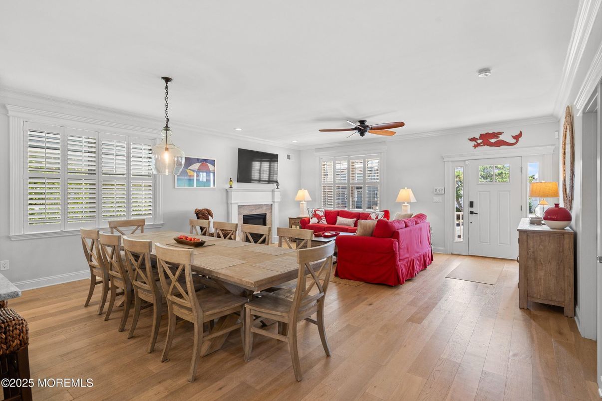 Dining room, Fireplace, Interior, Living room, Pendant Lights, Recessed Lighting, Wood Texture Flooring
