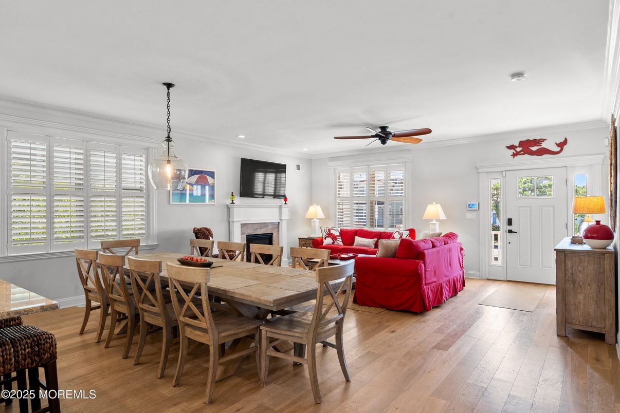 Dining room, Fireplace, Interior, Living room, Pendant Lights, Recessed Lighting, Wood Texture Flooring