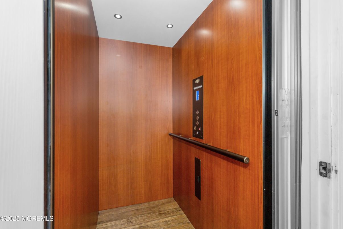 Elevator, Interior, Recessed Lighting, Wood Texture Flooring, Wooden Walls