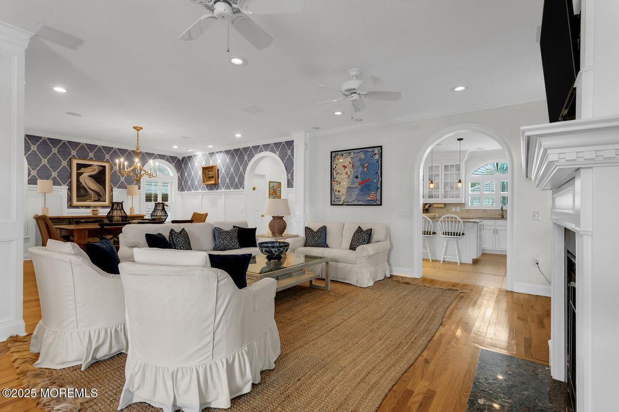 Chandelier, Dining room, Fireplace, Interior, Living room, Pendant Lights, Recessed Lighting, Wood Texture Flooring