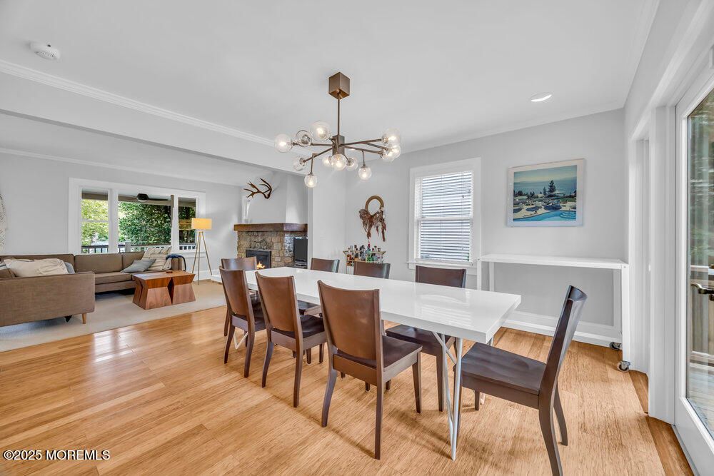 Dining room, Fireplace, Interior, Living room, Pendant Lights, Recessed Lighting, Wood Texture Flooring