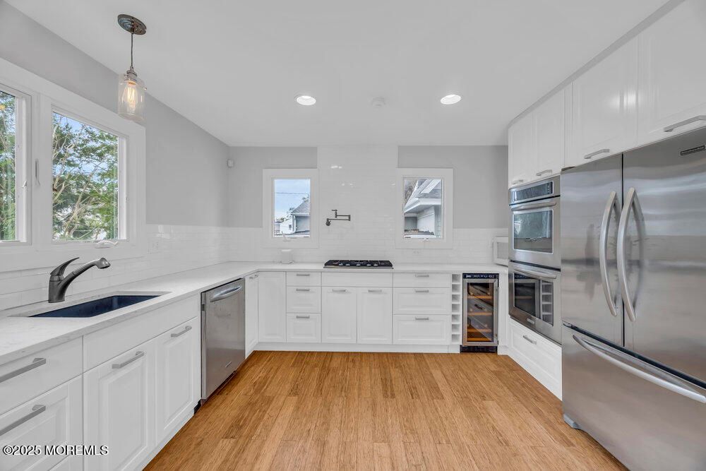 Interior, Kitchen, Pendant Lights, Recessed Lighting, Stainless Steel Appliances, Wood Texture Flooring