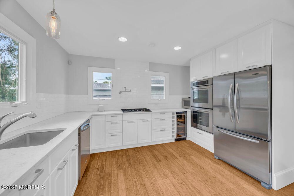 Interior, Kitchen, Pendant Lights, Recessed Lighting, Stainless Steel Appliances, Wood Texture Flooring