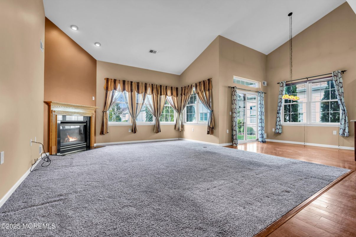 Empty room, Fireplace, Interior, Pendant Lights, Recessed Lighting, Wood Texture Flooring