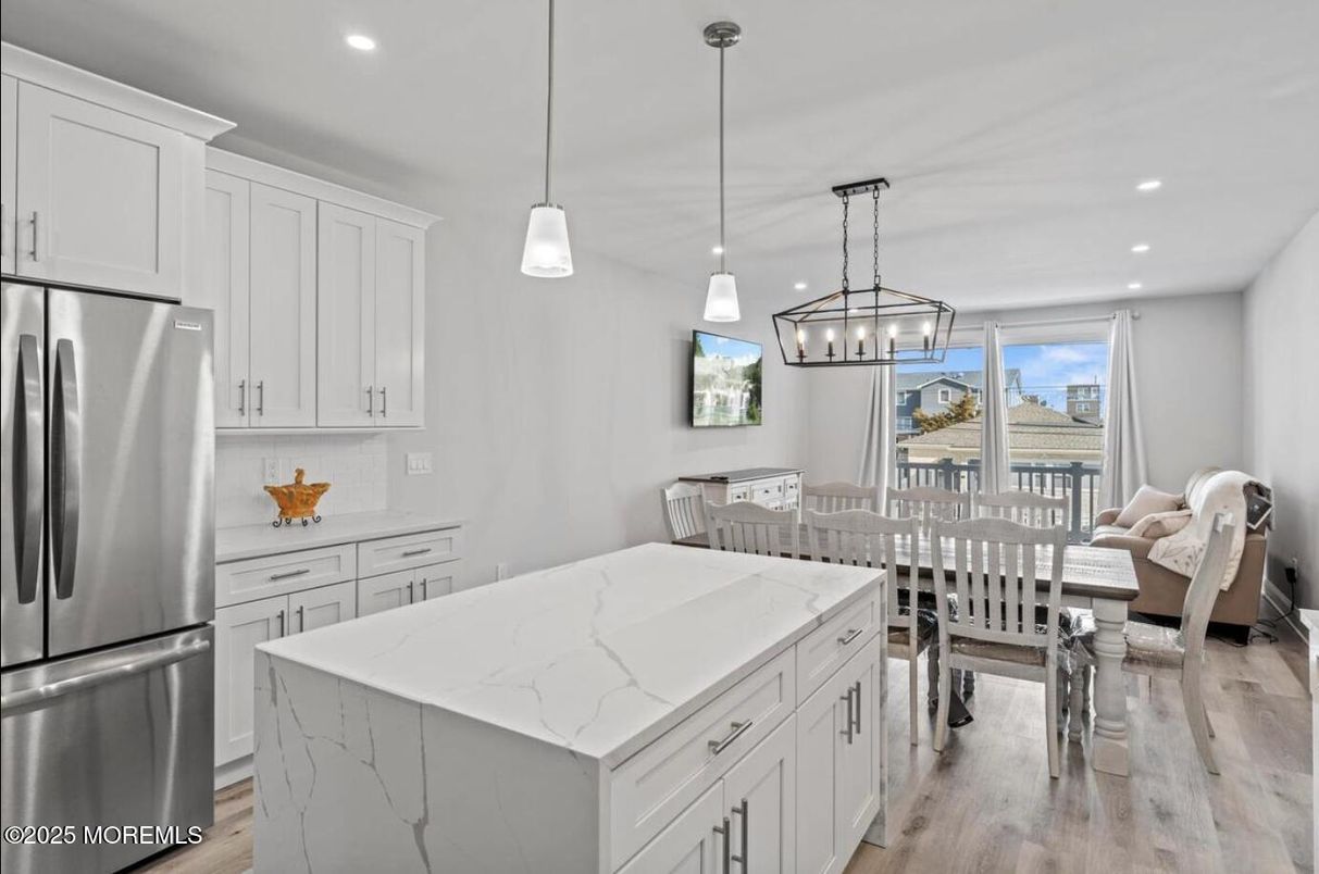 Dining room, Interior, Kitchen, Pendant Lights, Recessed Lighting, Stainless Steel Appliances, Wood Texture Flooring
