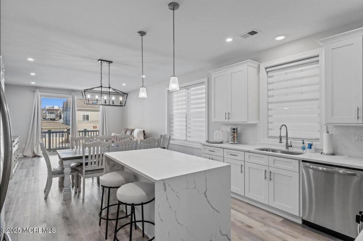 Dining room, Interior, Kitchen, Pendant Lights, Recessed Lighting, Stainless Steel Appliances, Wood Texture Flooring