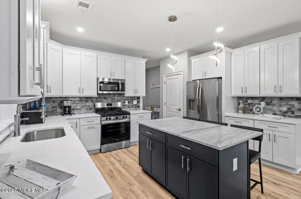 Interior, Kitchen, Pendant Lights, Recessed Lighting, Stainless Steel Appliances, Wood Texture Flooring