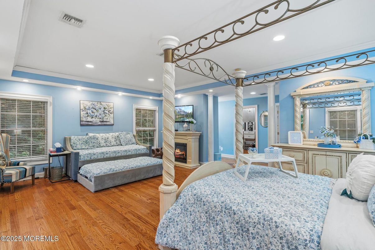 Bedroom, Fireplace, Interior, Recessed Lighting, Wood Texture Flooring