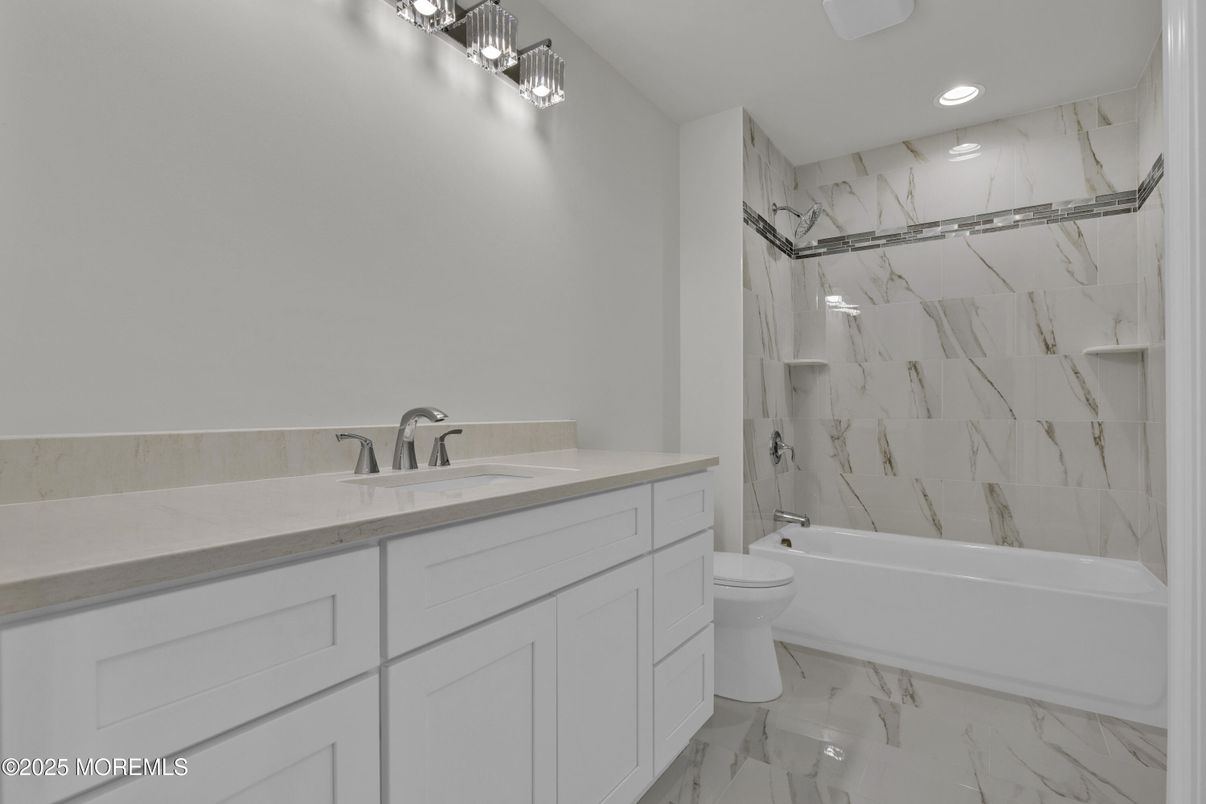 Bathroom, Dual Sink Vanities, Interior, Marble, Marble Walls, Recessed Lighting