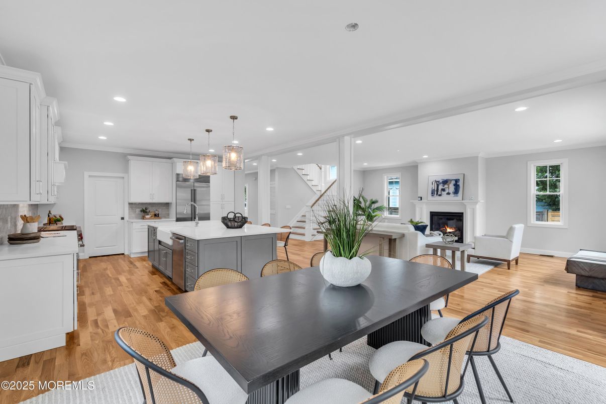 Dining room, Fireplace, Interior, Kitchen, Living room, Pendant Lights, Recessed Lighting, Stainless Steel Appliances, Wood Texture Flooring