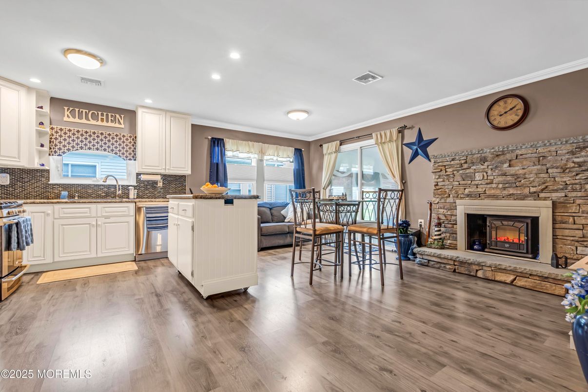 Fireplace, Interior, Kitchen, Recessed Lighting, Stone Walls, Wood Texture Flooring