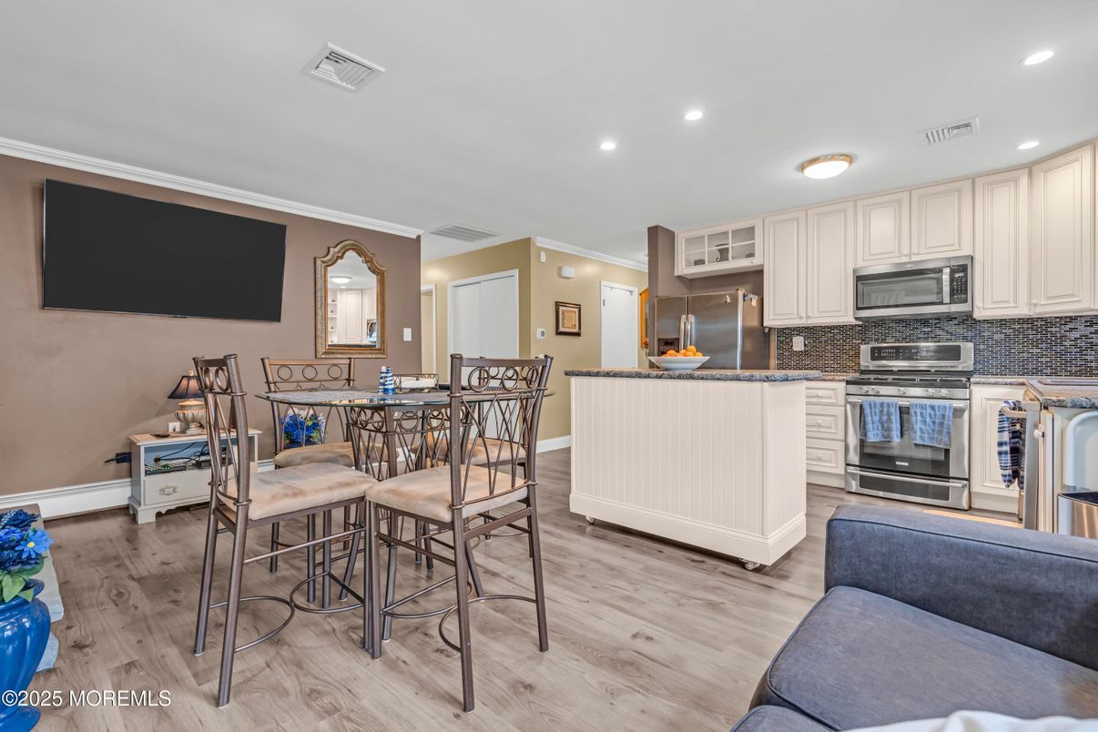 Dining room, Interior, Kitchen, Recessed Lighting, Stainless Steel Appliances, Wood Texture Flooring