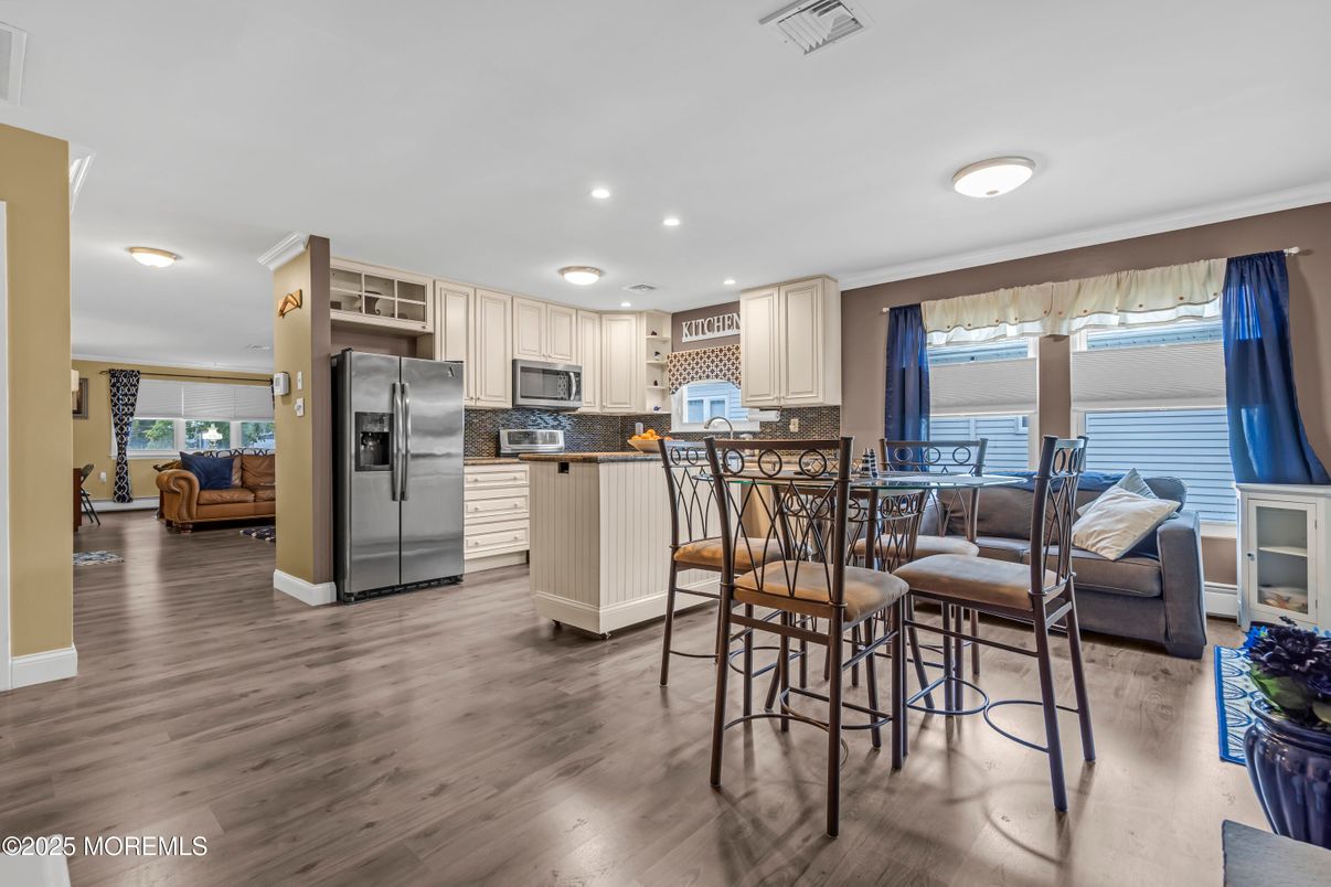 Dining room, Interior, Kitchen, Living room, Recessed Lighting, Stainless Steel Appliances, Wood Texture Flooring