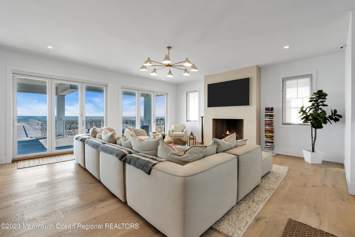 Fireplace, Interior, Living room, Pendant Lights, Recessed Lighting, Water, Wood Texture Flooring