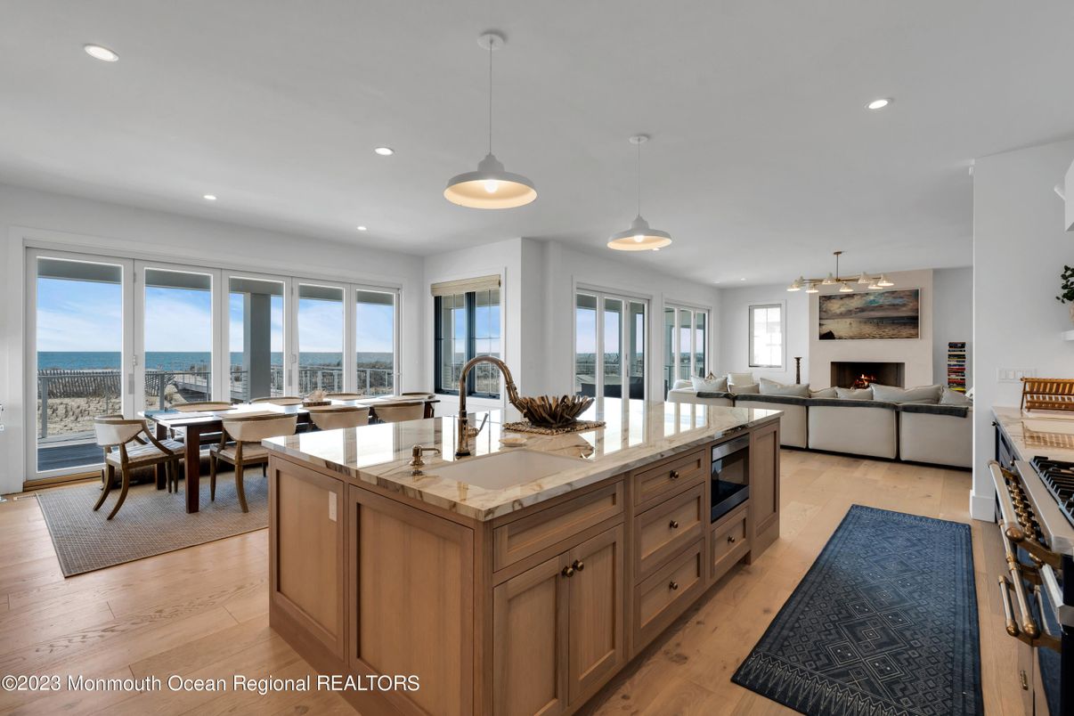 Dining room, Fireplace, Interior, Kitchen, Living room, Pendant Lights, Recessed Lighting, Water, Wood Texture Flooring