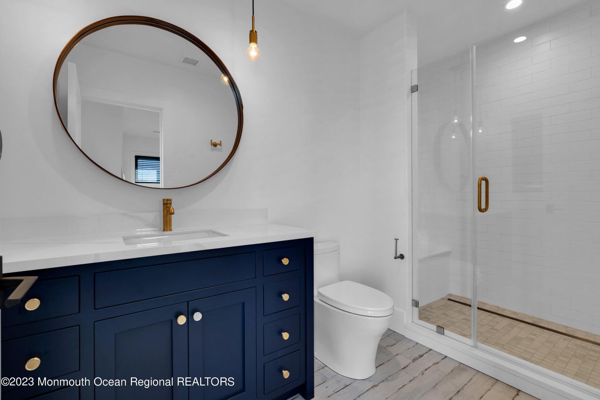 Bathroom, Glass Shower, Interior, Pendant Lights, Recessed Lighting, Wood Texture Flooring