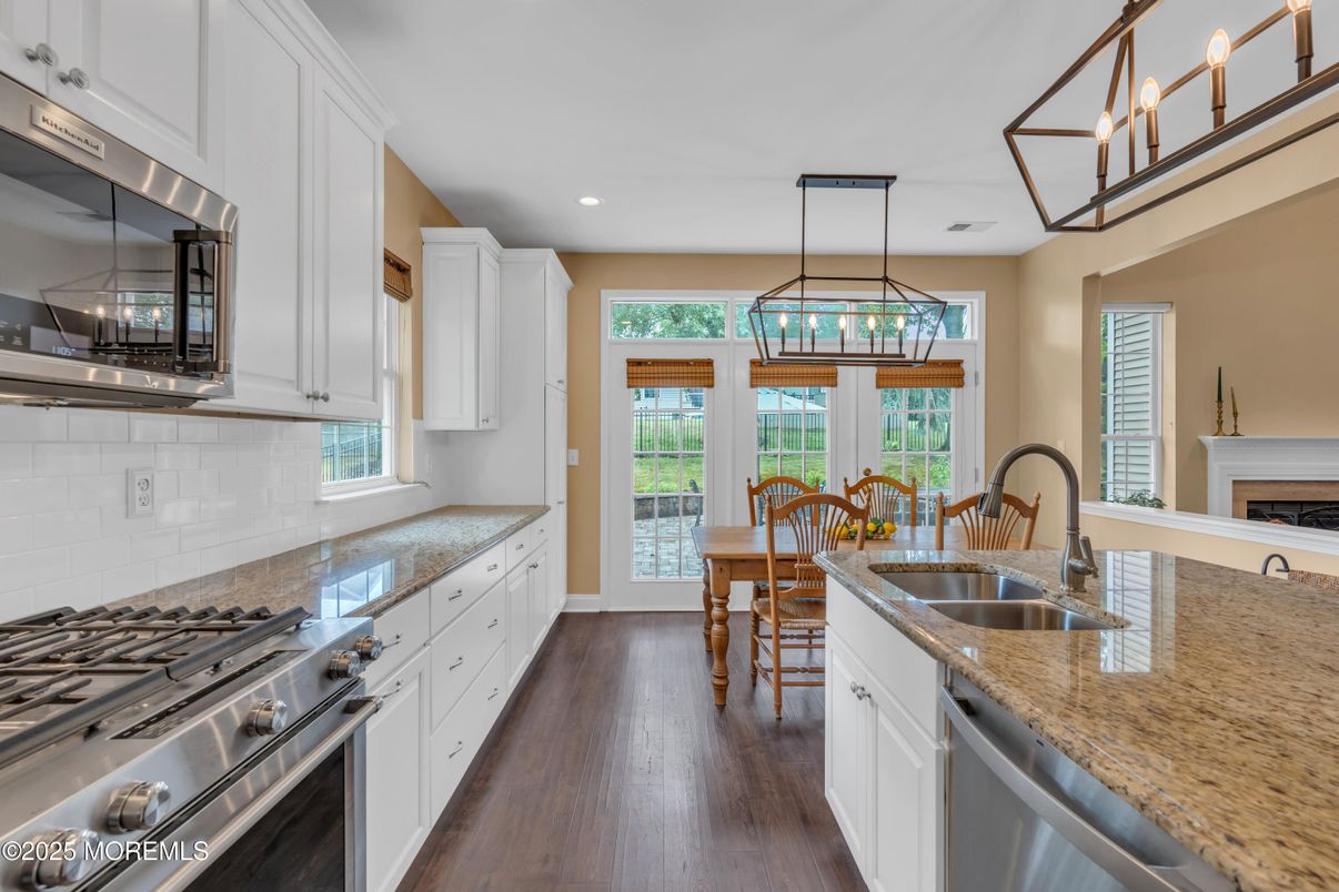 Dining room, Interior, Kitchen, Pendant Lights, Recessed Lighting, Stainless Steel Appliances, Wood Texture Flooring
