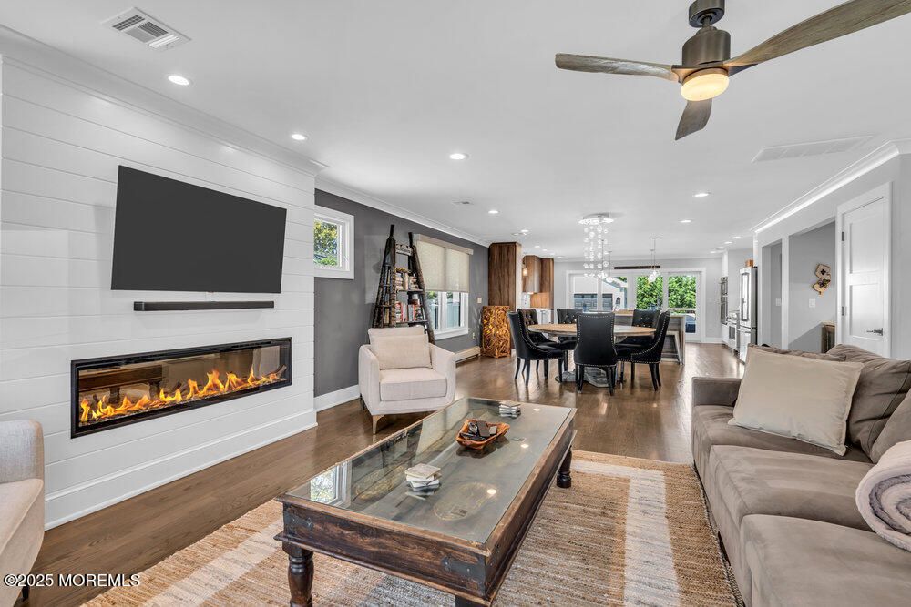 Dining room, Fireplace, Interior, Living room, Pendant Lights, Recessed Lighting, Wood Texture Flooring