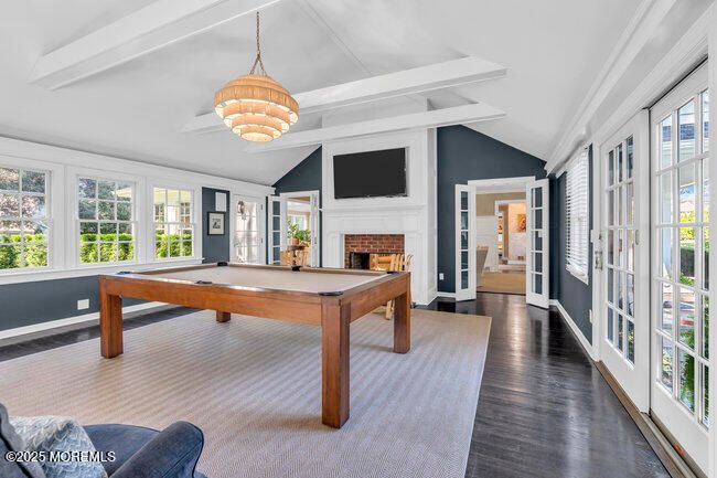 Billiard Table, Chandelier, Fireplace, Game Room, Interior, Pendant Lights, Wood Texture Flooring