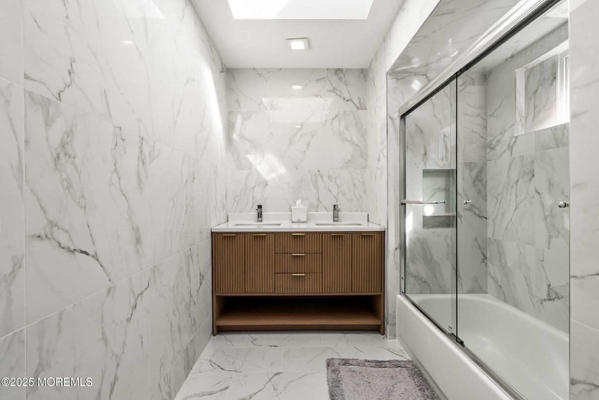 Bathroom, Dual Sink Vanities, Glass Shower, Interior, Marble, Marble Walls, Recessed Lighting