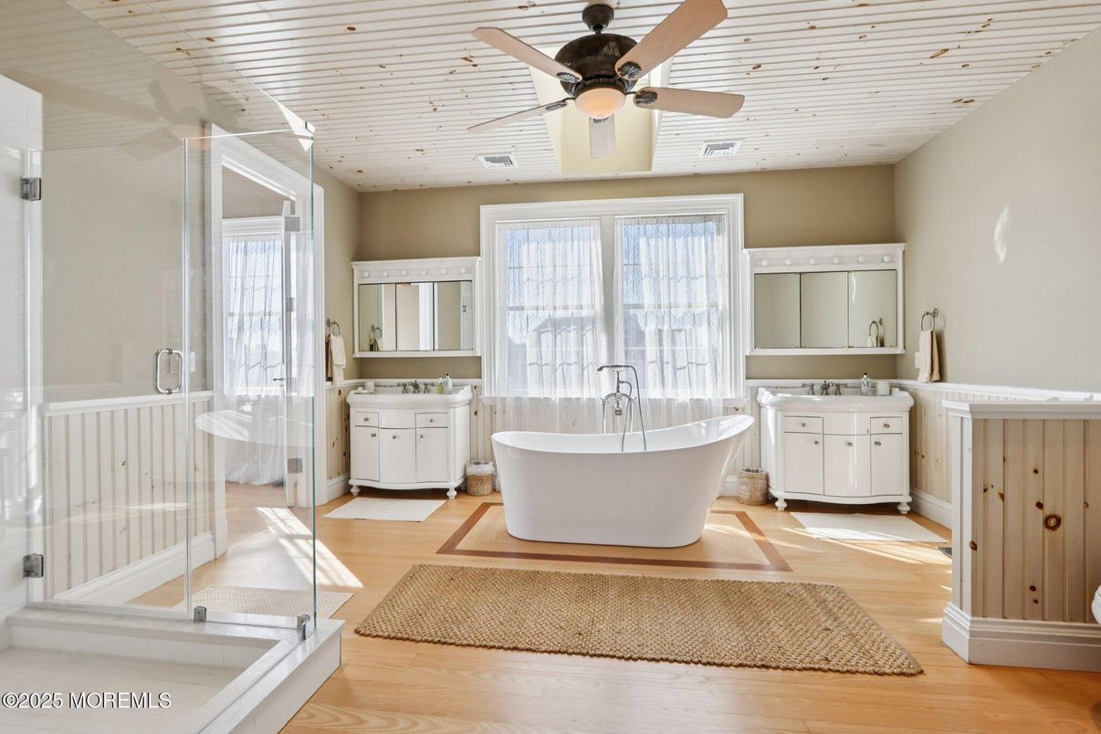 Bathroom, Free Standing Baths, Glass Shower, Interior, Recessed Lighting, Wood Texture Flooring