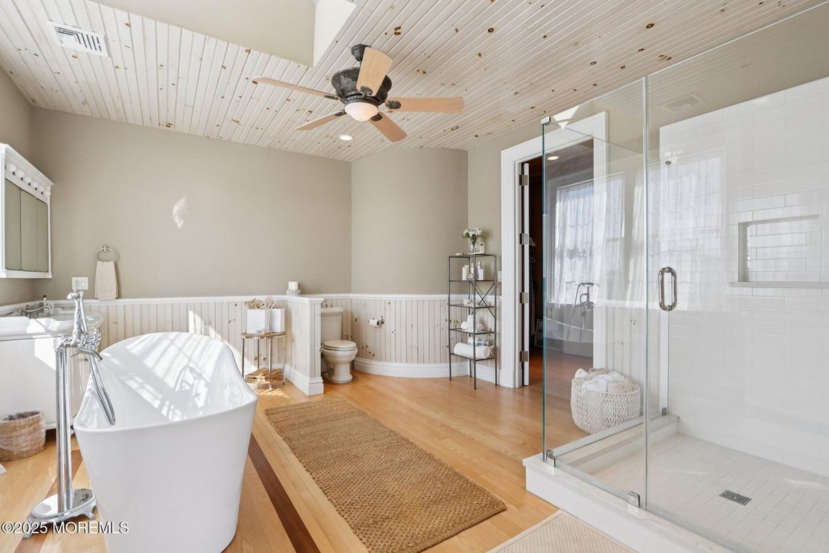 Bathroom, Free Standing Baths, Glass Shower, Interior, Recessed Lighting, Wood Texture Flooring