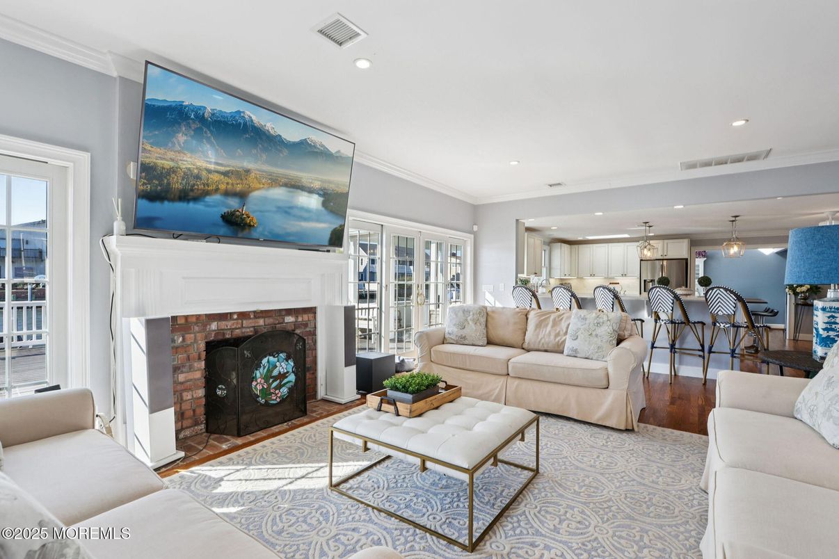 Dining room, Fireplace, Interior, Living room, Pendant Lights, Recessed Lighting, Wood Texture Flooring