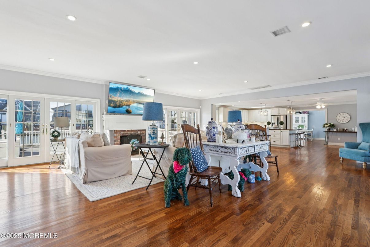 Dining room, Fireplace, Interior, Living room, Pendant Lights, Recessed Lighting, Wood Texture Flooring