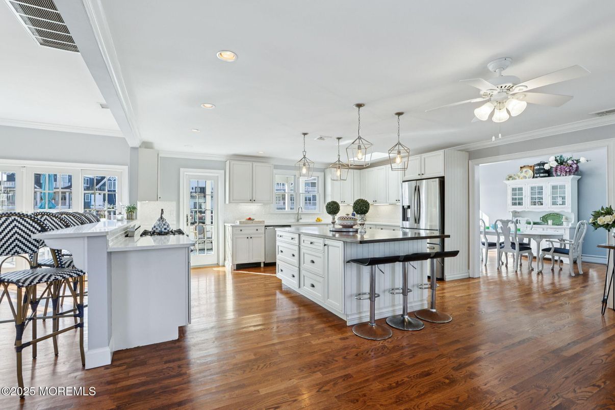 Dining room, Interior, Kitchen, Pendant Lights, Recessed Lighting, Stainless Steel Appliances, Wood Texture Flooring