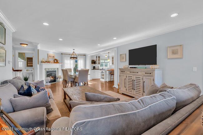 Dining room, Fireplace, Interior, Living room, Pendant Lights, Recessed Lighting, Wood Texture Flooring