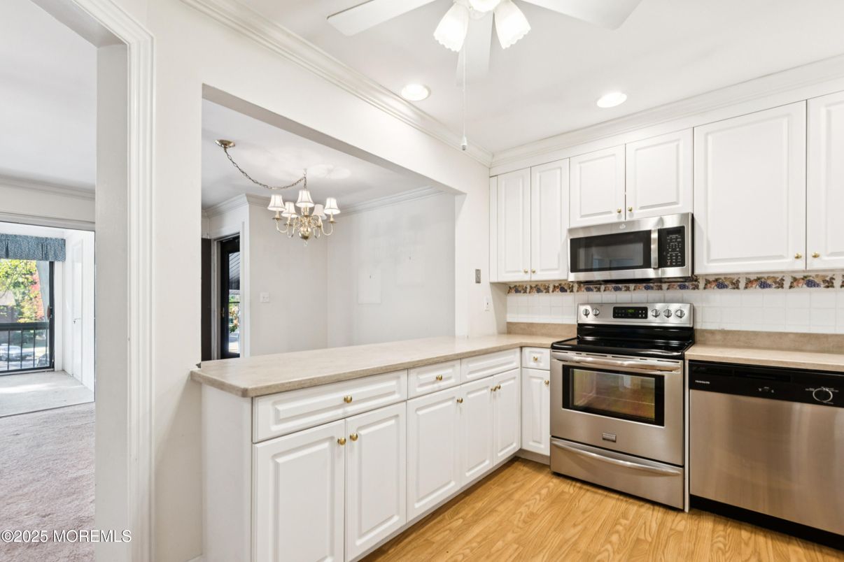 Chandelier, Interior, Kitchen, Recessed Lighting, Stainless Steel Appliances, Wood Texture Flooring