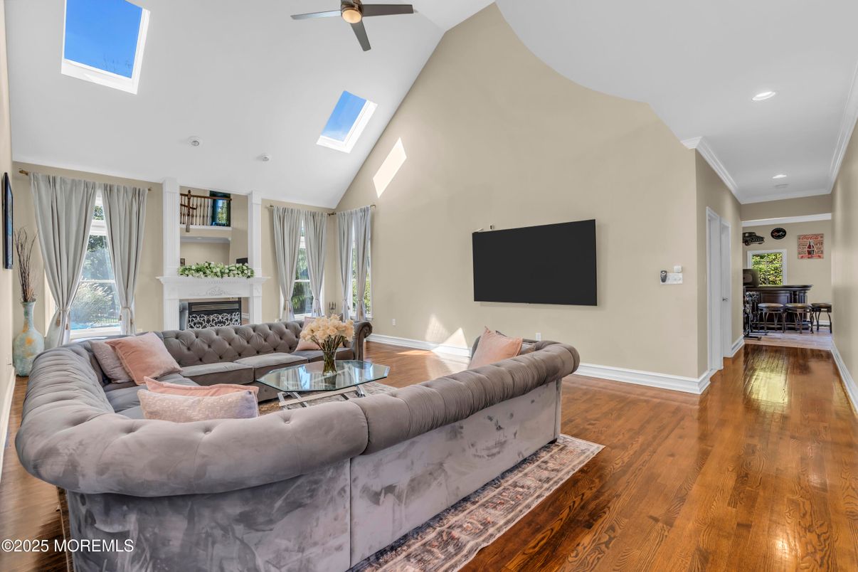 Dining room, Fireplace, Interior, Living room, Recessed Lighting, Wood Texture Flooring