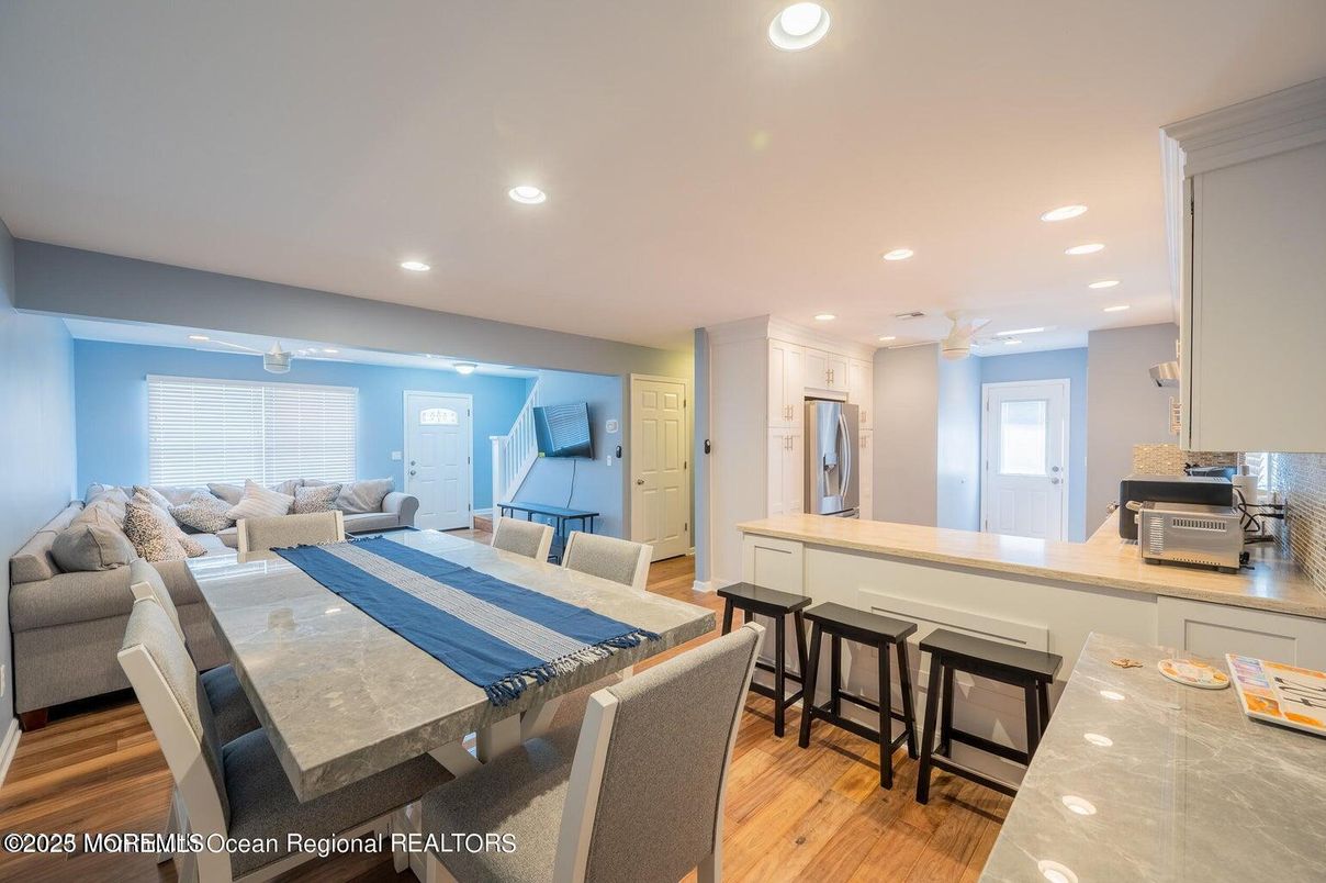 Dining room, Interior, Kitchen, Living room, Recessed Lighting, Stainless Steel Appliances, Wood Texture Flooring