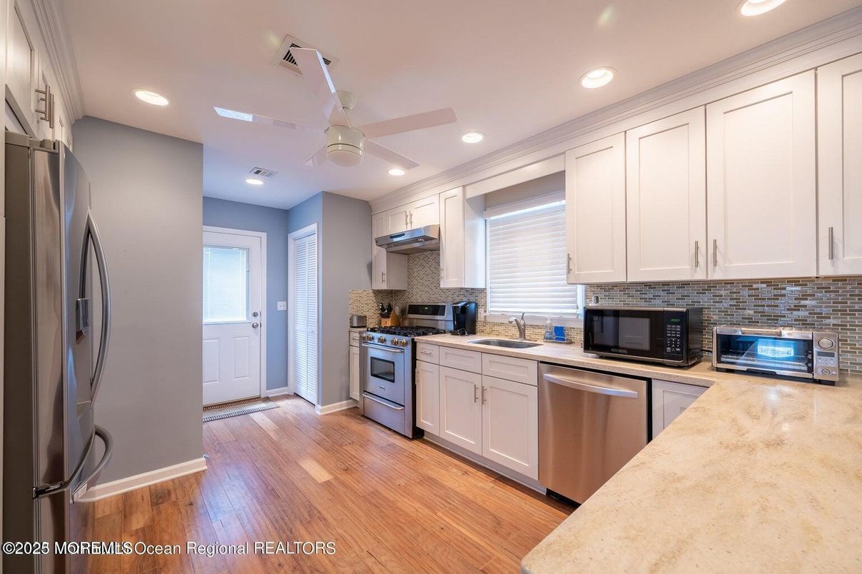 Interior, Kitchen, Recessed Lighting, Stainless Steel Appliances, Wood Texture Flooring