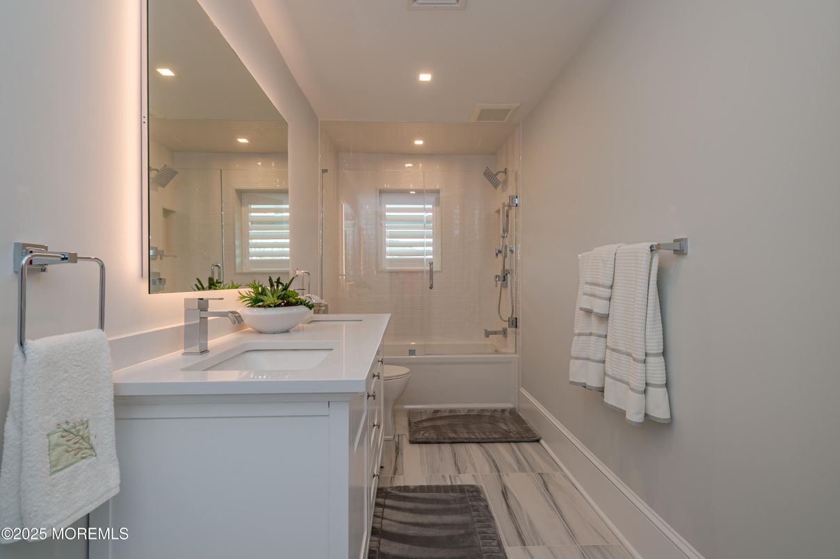 Bathroom, Dual Sink Vanities, Glass Shower, Interior, Recessed Lighting, Wood Texture Flooring
