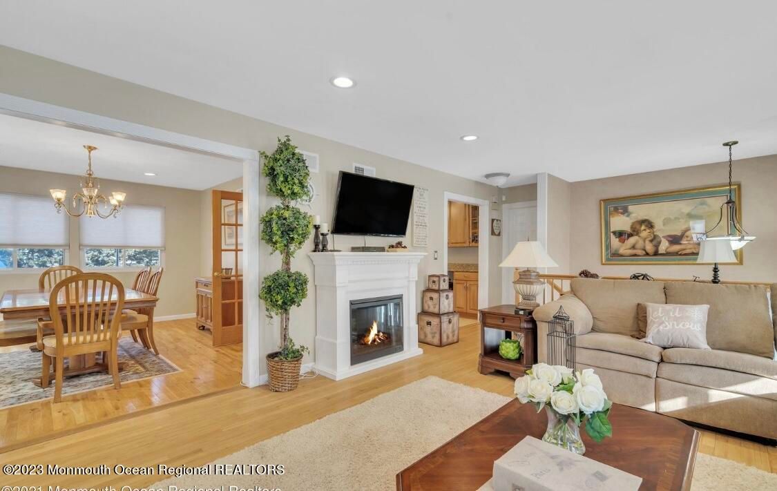 Chandelier, Dining room, Fireplace, Interior, Living room, Recessed Lighting, Wood Texture Flooring