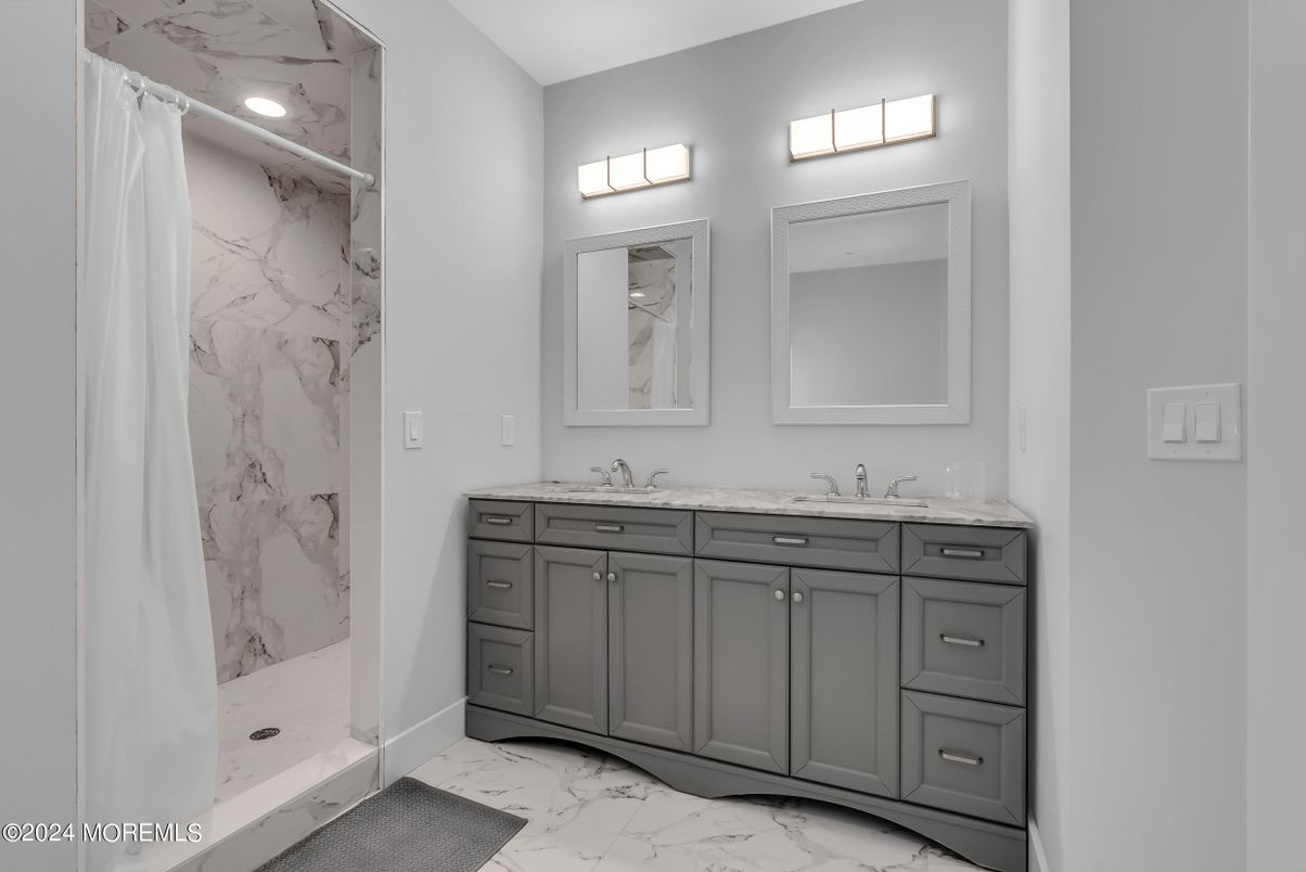Bathroom, Dual Sink Vanities, Glass Shower, Interior, Marble, Marble Walls, Recessed Lighting