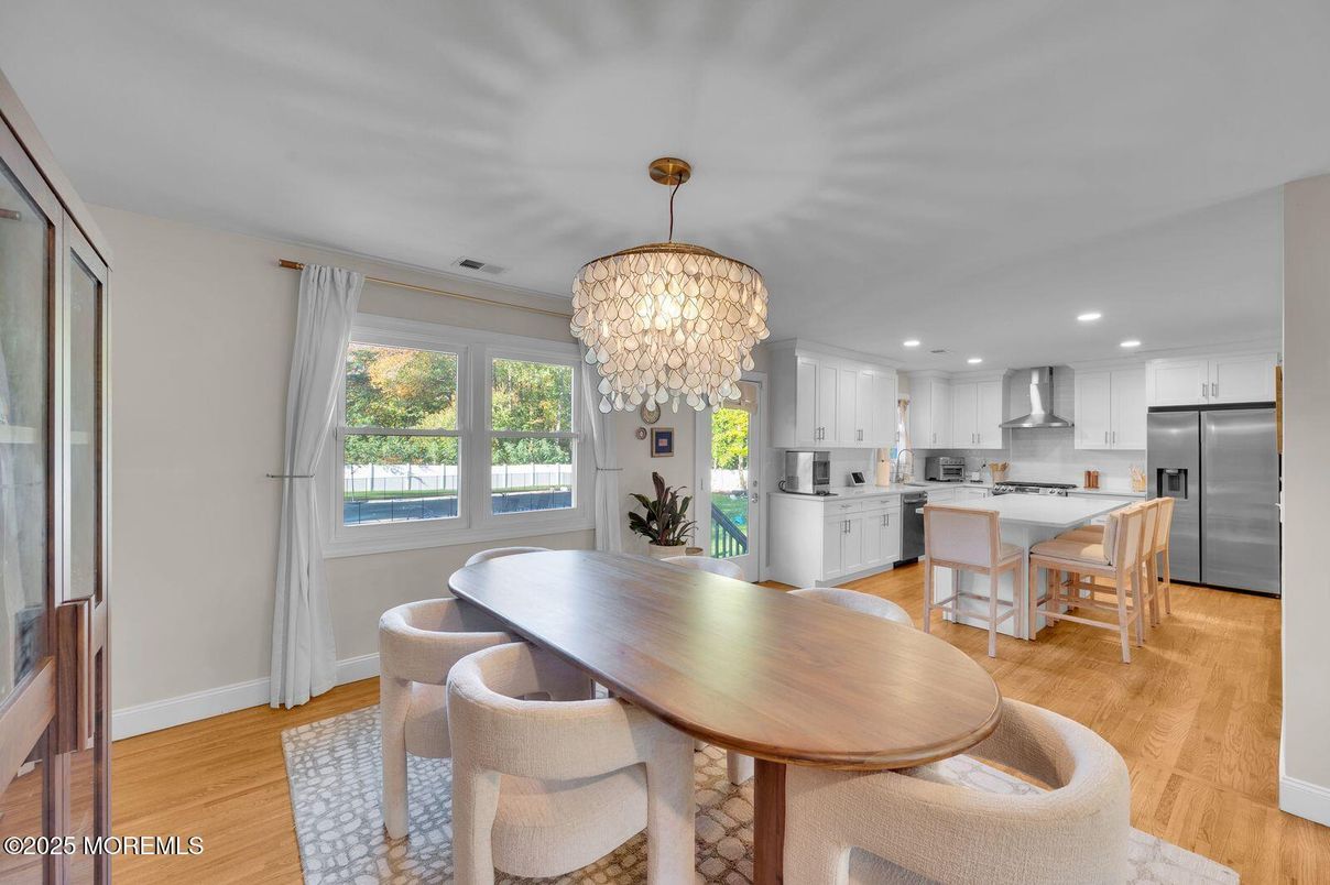 Chandelier, Dining room, Interior, Kitchen, Recessed Lighting, Stainless Steel Appliances, Wood Texture Flooring