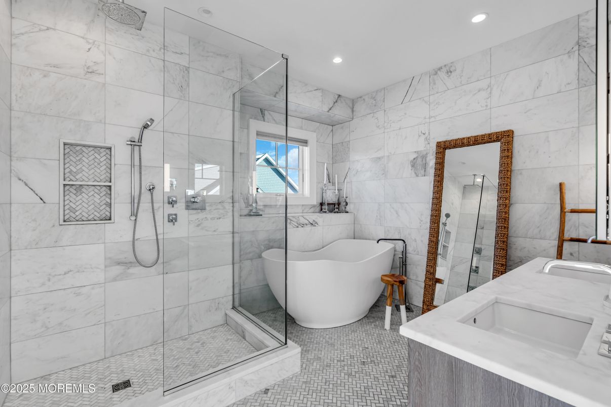 Bathroom, Dual Sink Vanities, Free Standing Baths, Glass Shower, Interior, Marble Walls, Recessed Lighting