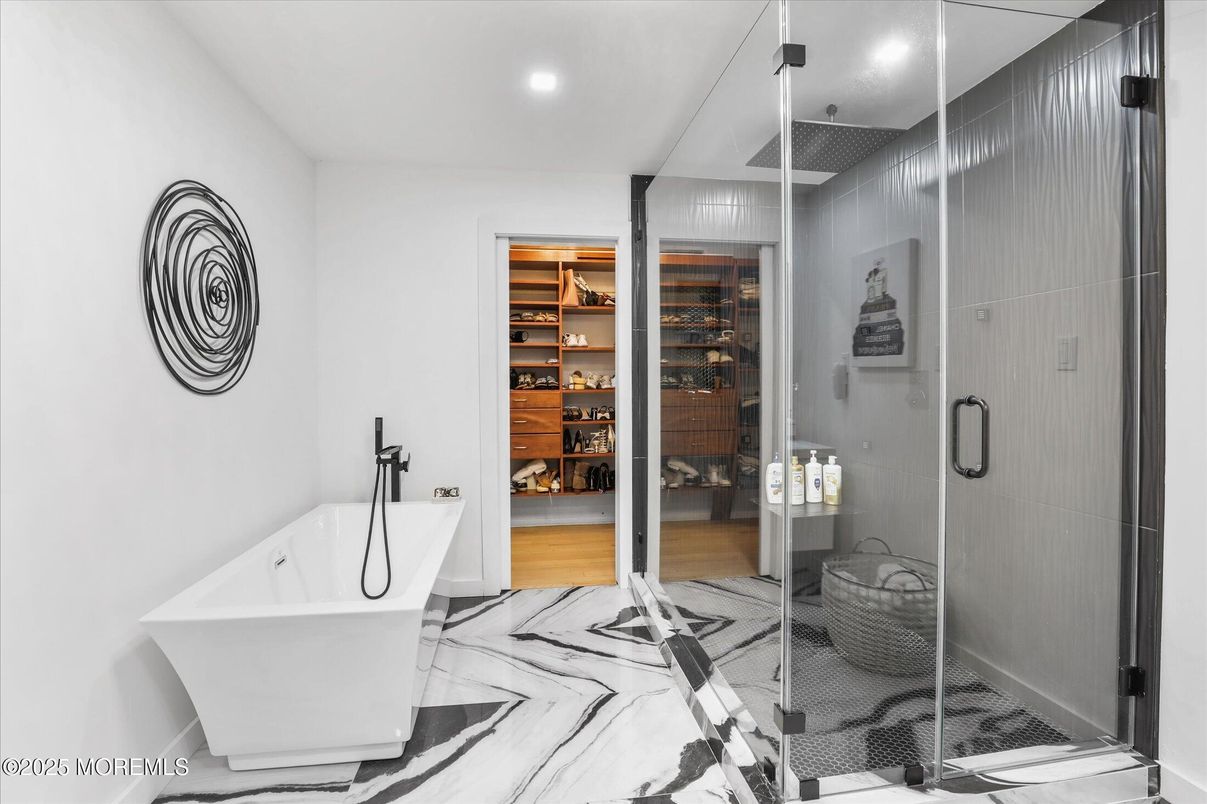 Bathroom, Free Standing Baths, Glass Shower, Interior, Marble, Recessed Lighting, Walk-in Closets, Wood Texture Flooring