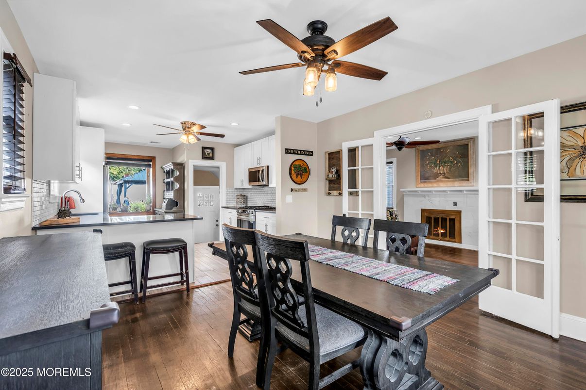Dining room, Fireplace, Interior, Kitchen, Recessed Lighting, Wood Texture Flooring