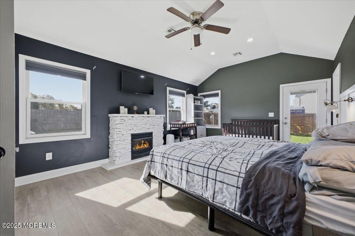 Bedroom, Fireplace, Interior, Recessed Lighting, Wood Texture Flooring