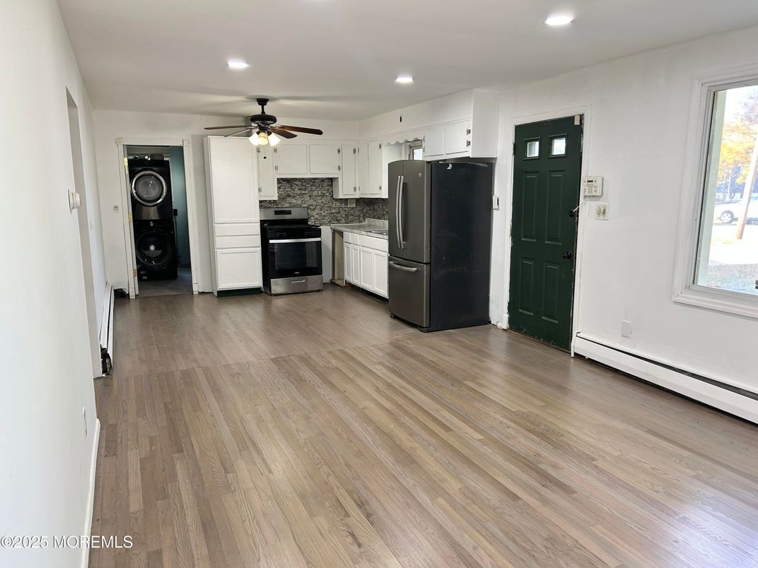 Interior, Kitchen, Recessed Lighting, Washer, Wood Texture Flooring