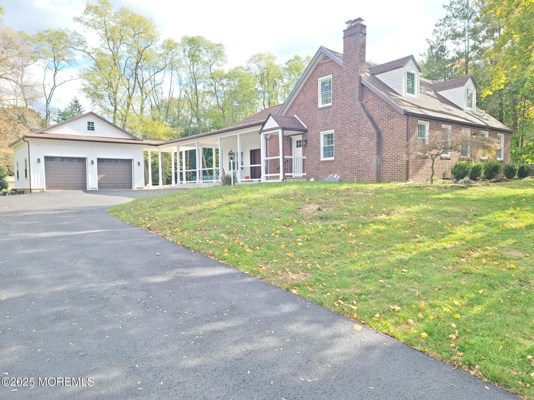 Attached, Backyard, Exterior, Facade, Brick Facade, Tudor Revival