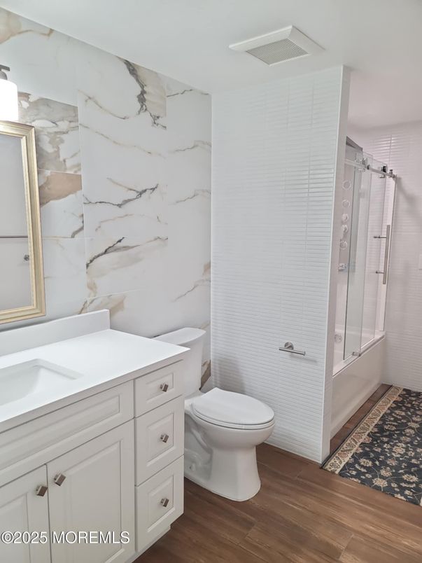 Bathroom, Glass Shower, Interior, Marble Walls, Wood Texture Flooring