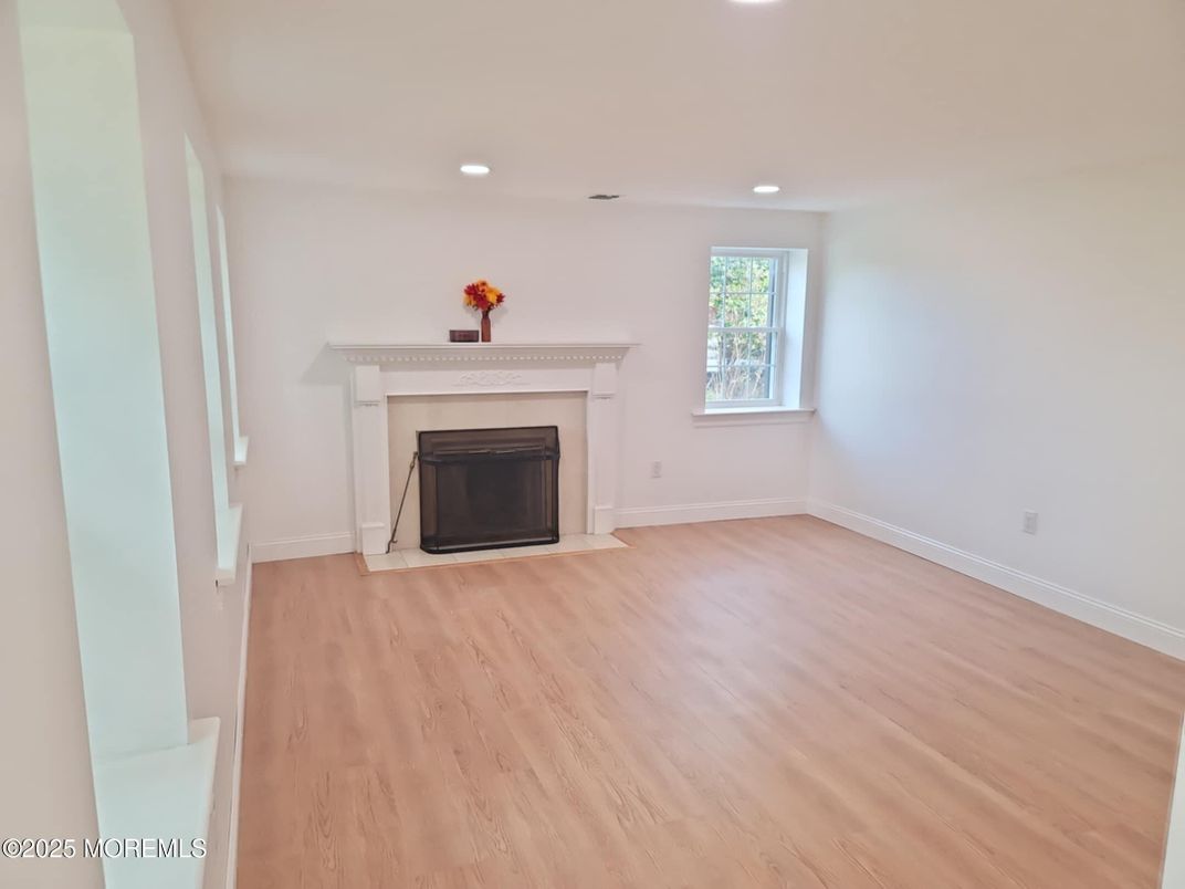 Empty room, Fireplace, Interior, Recessed Lighting, Wood Texture Flooring
